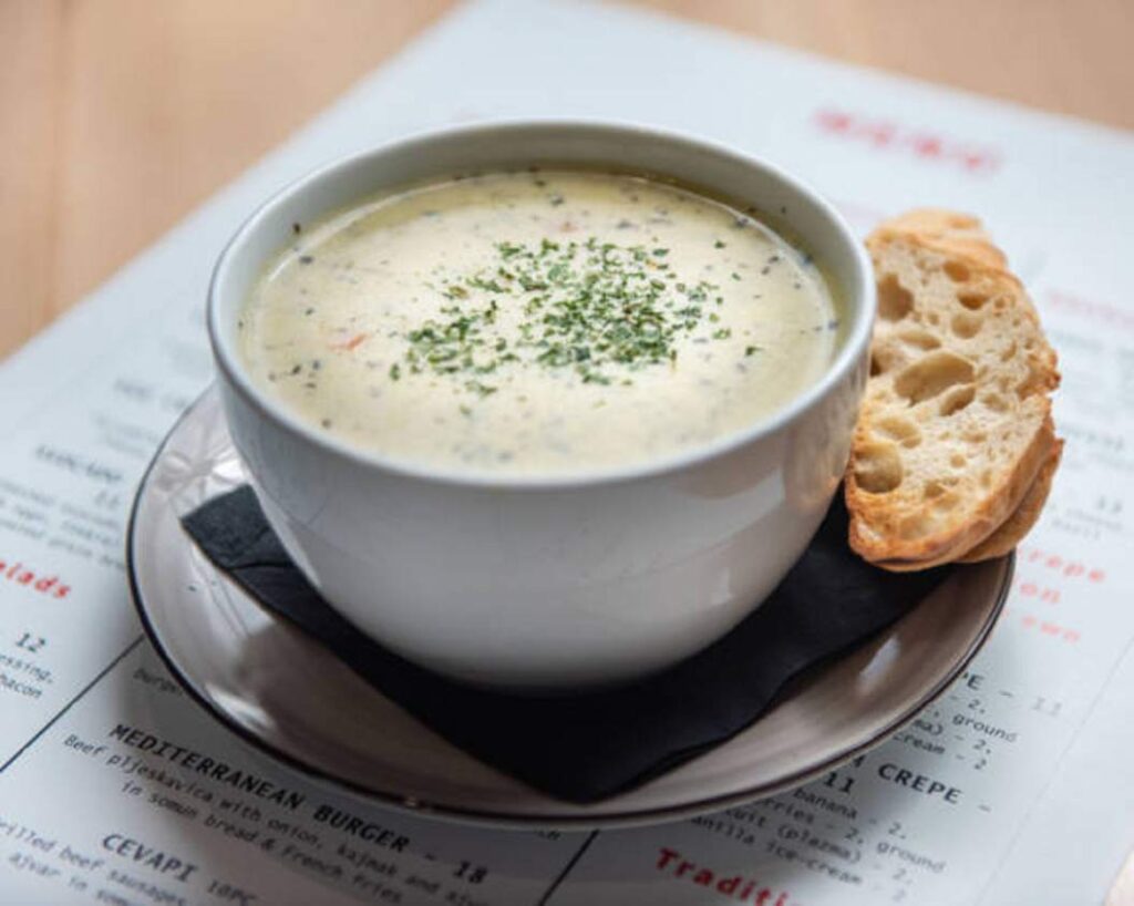 A spoonful of creamy Leek and Potato Soup being enjoyed.