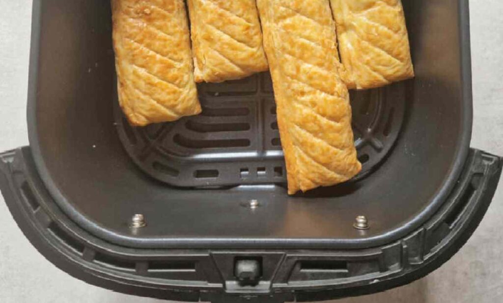 Flipping sausage rolls in air fryer