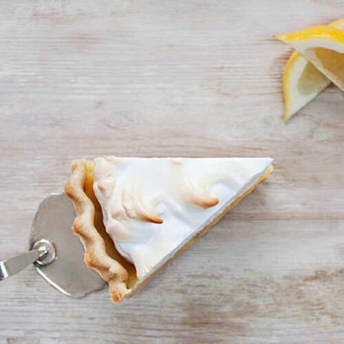 Ingredients for Mary Berry's lemon meringue pie arranged neatly on a kitchen counter.