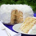 Sliced Mary Berry Coconut Cake on a Serving Plate