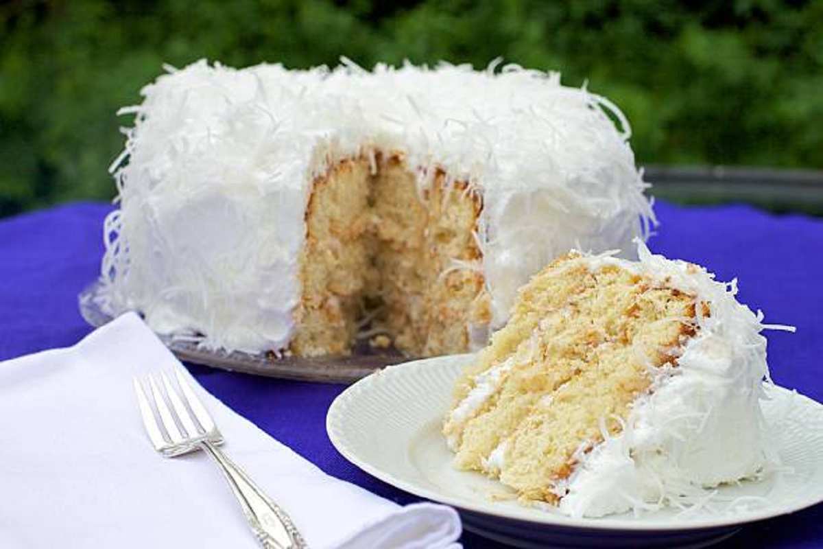 Sliced Mary Berry Coconut Cake on a Serving Plate